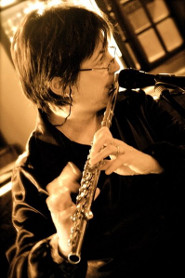 Delia playing Flute